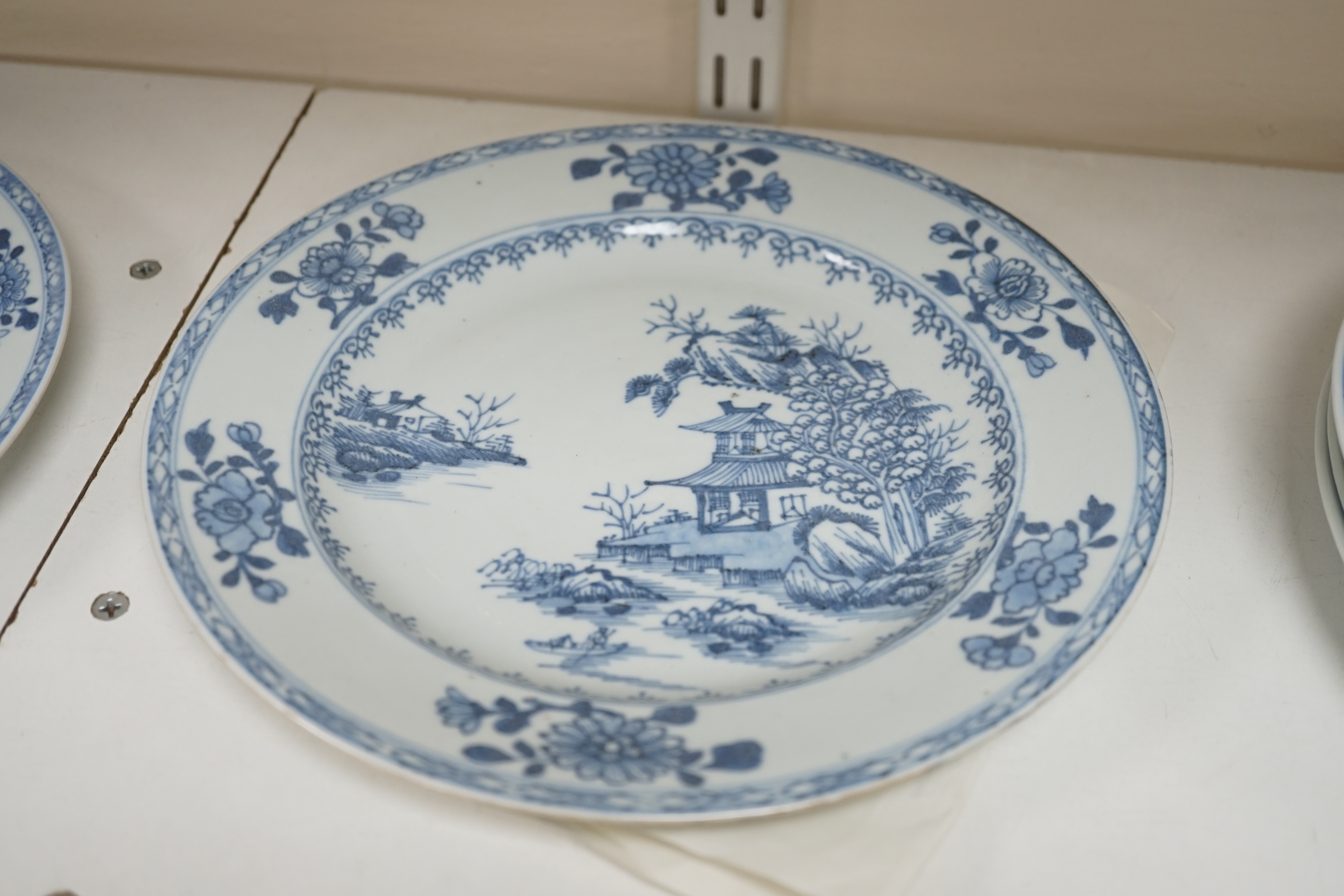 A set of twelve Chinese Nanking Cargo ‘Boatman’ blue and white plates, Qianlong period